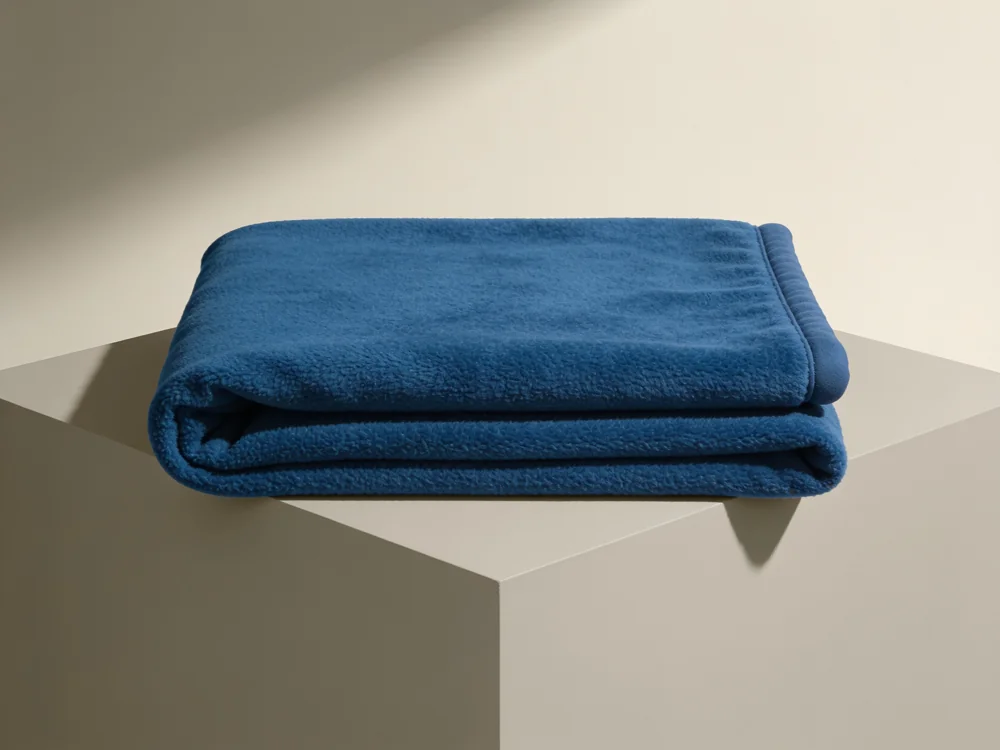 Recycled-poly fleece throw — 100% recycled polyester, fleece construction